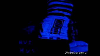 Seductive Dance Under Black Lights With Emphasis On Buttocks